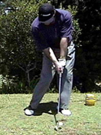 nick faldo hitting golf shot iron